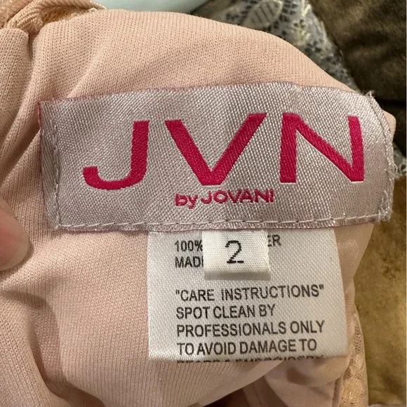 JOVANI mini illusion dress. With sheer material and gold stones. Size 2